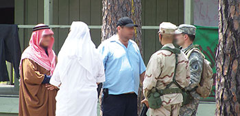 Students meet with Freedom Village officials, a tribal elder, the Imam, and the police chief.