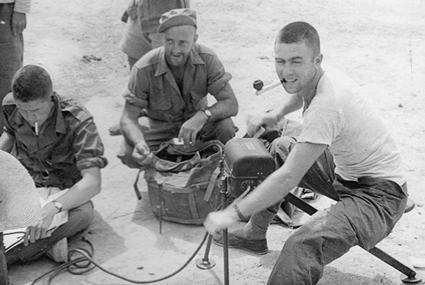 A member of SO Team LEOPARD cranks a generator to power the team’s radio, China, 1945.