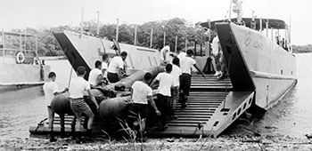 CPT José Eduardo Iraheta and the other Salvadoran Ranger students practice loading the RB-15 aboard a Landing Craft, Medium (LCM) on the shore of Gatun Lake.