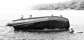 The Rangers practice emergency &ldquo;righting&rdquo; of the RB-15 in Gatun Lake after it has overturned.