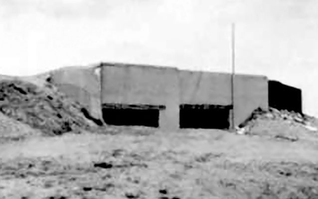 The Siegfried Line near Minden, Germany, contained forty pillboxes per square mile, defensive trench systems, and minefields. The rolling terrain had little vegetation.