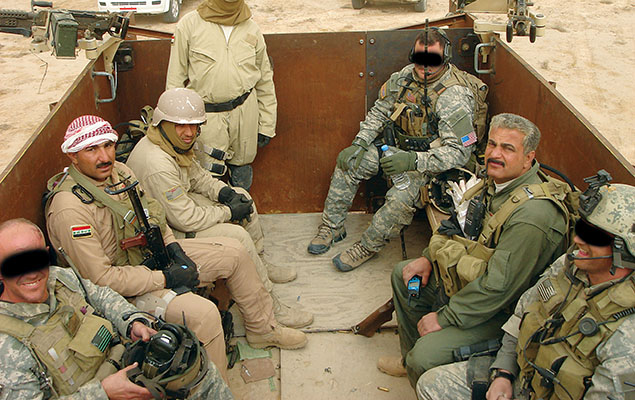 Iraqi Colonel Abbas, the current commander of the Hilla SWAT (right side center), often rode in the bed of the ODA 563 &ldquo;War Pig,&rdquo; an armored 5-ton  truck with three M-240 machineguns.