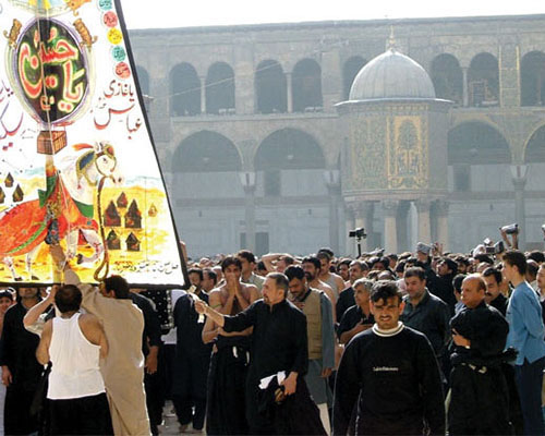 Pilgrims fill the plaza surrounding the Imam Ali mosque during Ashura, the tenth day of Muharram.