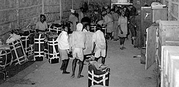 Air Drop supply bundles are rigged with parachutes at a Detachment 101 supply warehouse, 1944-1945.