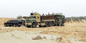 B Company, 2/3 Infantry Strykers, ODA 563 with its five-ton &ldquo;War Wagon,&rdquo; and the Hilla SWAT prepare to launch a combined assault from the south to clear the compound on 29 January.
