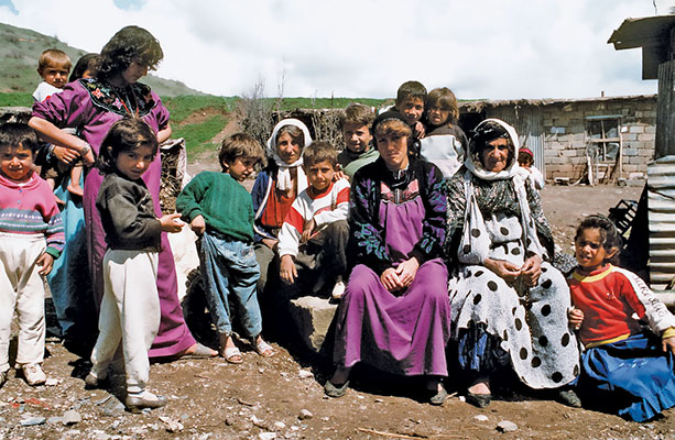 Kurdish refugees fleeing Saddam Hussein’s forces with all their worldly belongings pause for a rest on a road near a refugee camp. The refugees received aid from CJTF-Provide Comfort at the camp.