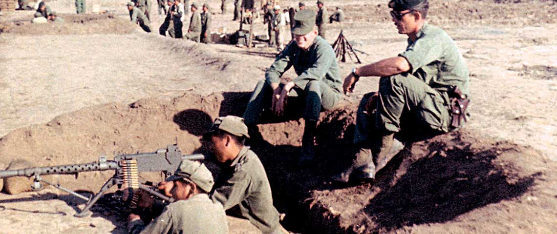 SGT Alvin E. Graham(r) training Bolivian infantrymen on the Browning M-1919A6 .30 caliber light machinegun. On Graham’s right is a cameraman from a SOUTHCOM film crew. SGT Graham, SSG Wendell P. Thompson, and SGT Byron R. Sigg were all radio operators who served as assistant instructors on the firing ranges.