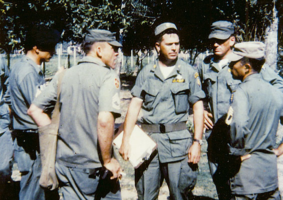 MAJ Ralph &ldquo;Pappy&rdquo; Shelton talks with SFC Ethyl Duffield and MSG Oliverio Gomez (right) at La Esperanza.