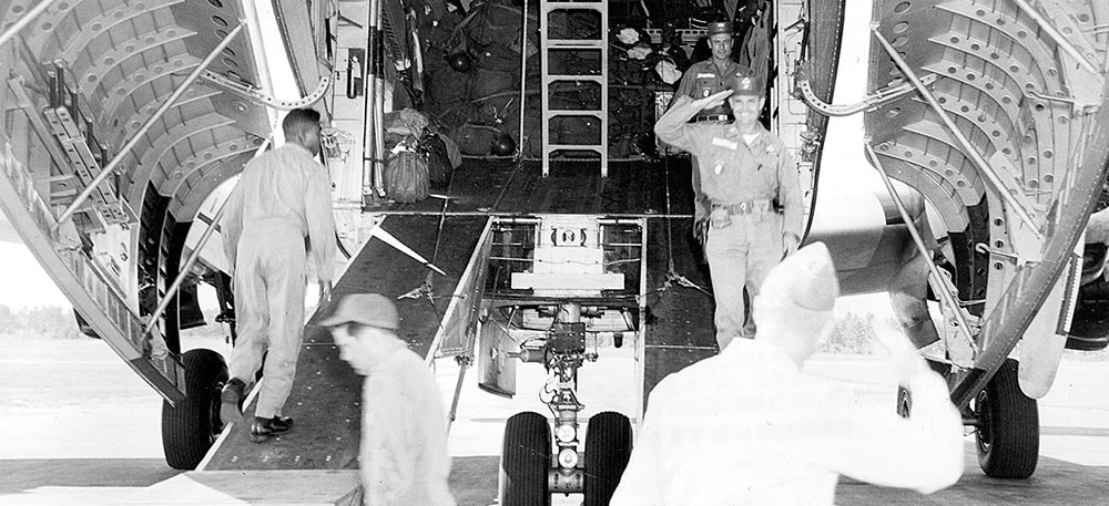 COL Blackburn welcomes LTC Magnus L. Smith back to Fort Bragg after Exercise BLACK PALM in 1959. Smith is wearing the Jungle Expert patch on his right shirt pocket.