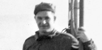 *Private Stanley Skowron standing on the fantail of his ship en route to America.