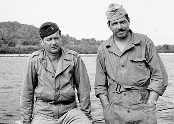 First Mate WOJG Flynn and 1LT Mess relax as they wait for the shore parties to return.