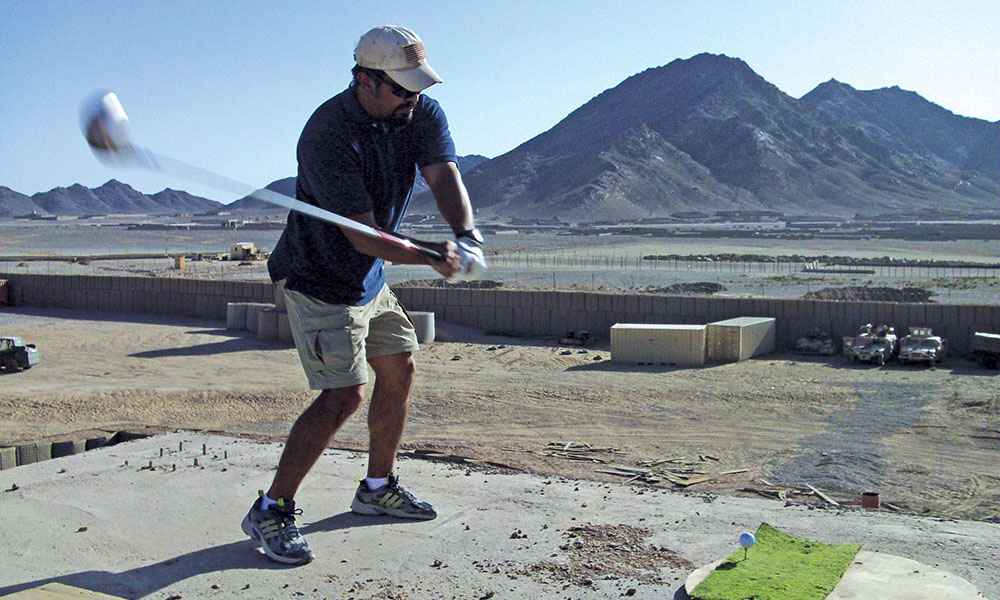 SSG Brian Moore on the makeshift driving range on top of a security tower.