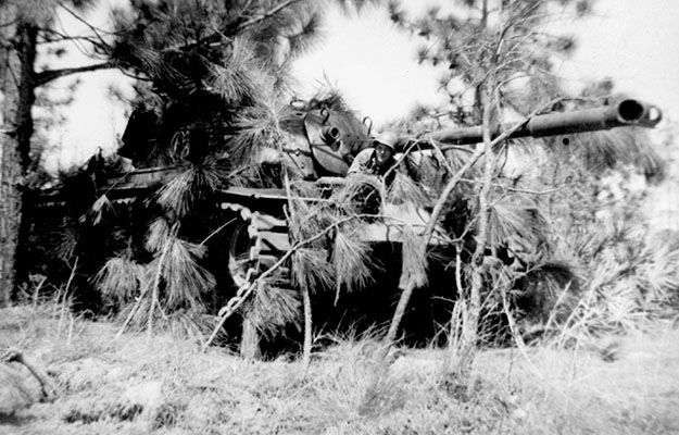 Private Stanley Skowron, C Company, 714th Armored Battalion, 82nd Airborne Division, at Camp Stewart, GA, for tank gunnery with an M-48 Patton tank, 1954.