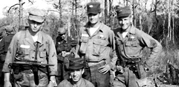 PFC Josef Masin, PFC Smith, MSG Jones, and SFC George Maracek, 77th SFG, after completing the 100+ mile march from Camp Lejeune to Fort Bragg, NC.