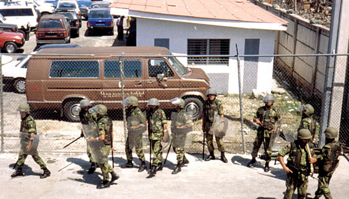 The Nepalese in full riot gear preparing to escort the garbage trucks into the city dump. Their training in crowd control was necessary to prevent riots and injuries at the dump.