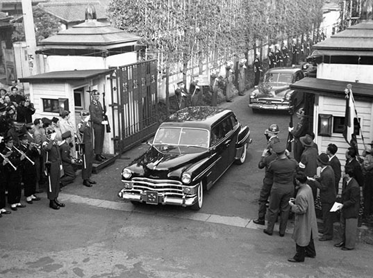 GEN MacArthur&rsquo;s limousine and entourage were protected by GHQ Honor Guards and given a wide berth as sirens announced its approach.