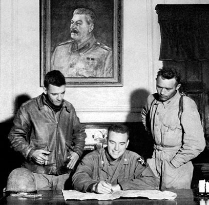 LTC Ralph Foster, seated at Kim Il Sung&rsquo;s desk, and members of TF INDIANHEAD searched government offices in P&rsquo;yongyang for documents and information regarding American POWs.