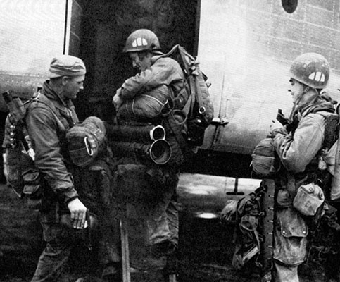 The 187th Infantry “Rakkasans” marked their helmets with a divided half-round pattern