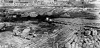 A field of 55 gallon fuel drums at the beach landing sites at Hungnam.