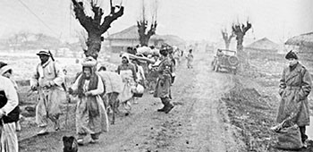 Infantry division MPs tried to control the thousands of North Korean refugees struggling to reach safety inside the Hungnam perimeter.