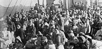 Some of the 14,000+ panic-stricken North Korean refugees stand shoulder to shoulder on the main decks of the SS <i>Meredith Victory</i> - December 24, 1950.