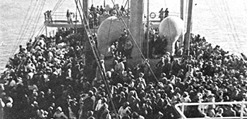 Some of the 14,000+ panic-stricken North Korean refugees stand shoulder to shoulder on the main decks of the SS <i>Meredith Victory</i> - December 24, 1950.