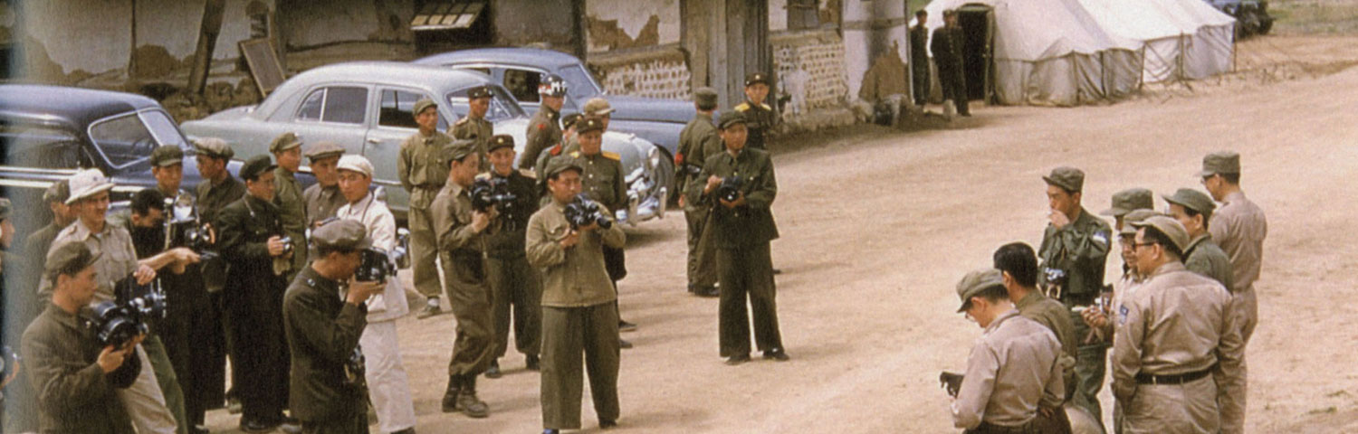 Correspondents from both the Communist countries and the UN Command size each other up.