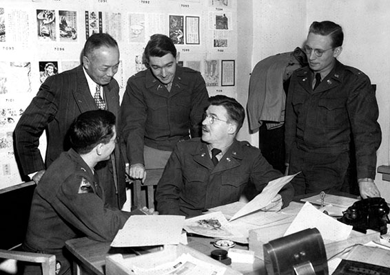 CPT Edward C. Janicik, the 1st RB&L Operations Officer, discusses a leaflet proposal.