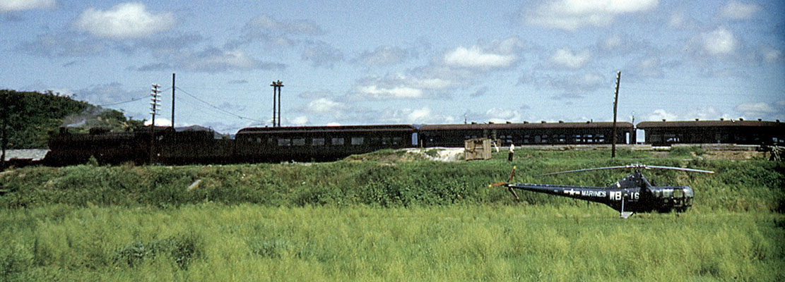 To get to antenna sites trucks and an antenna shelter were loaded aboard a flatcar of an ammunition train with the transmitter and antenna crates in boxcars. The riggers boarded Pullman cars like the one shown above. The Pusan-Taejon railway was a favorite guerrilla target. 