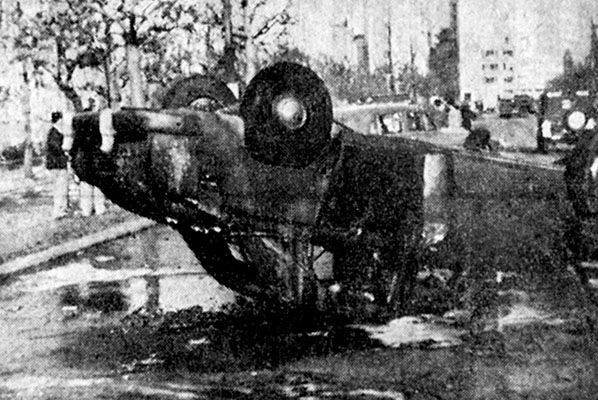 Humiliated by defeat, the rioting Reds overturned American cars and set them afire