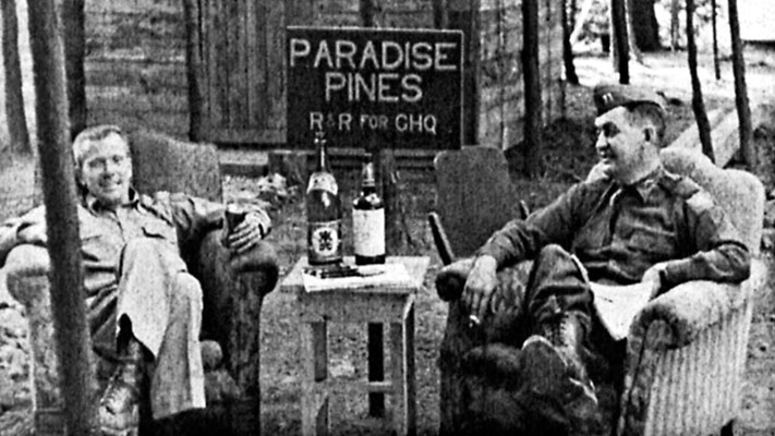 1LT Arthur E. Holch, 1st RB&L Radio News Operations, and CPT Frederick P. Laffey, 4th MRBC Radio Manager, relax in &lsquo;Paradise Pines&rsquo; during a field visit to <i>Radio Pusan</i>.