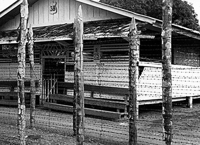 Outer perimeter and barracks building at the Davao Penal Colony used by the Japanese as a Prisoner of War (POW) camp.