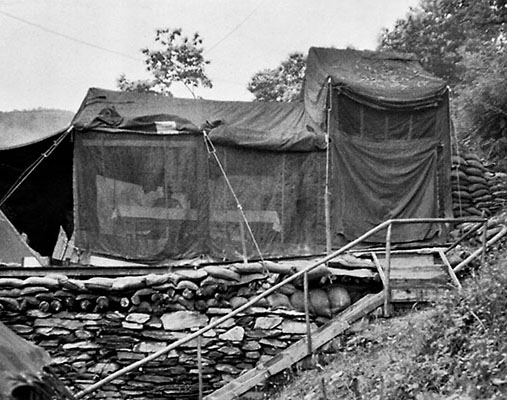 The TLO mess tent was placed on top of the sand-bagged arms and ammo tent/bunker between the American and agent tents.