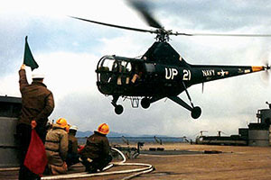 Lift off of a Sikorsky HO3S-1, April 1953. Designed for utility, this helicopter weighed 3,788 pounds and it had a maximum lift capacity of 4,985 pounds. It could accommodate one crew member, three passengers, and 145 pounds of baggage, and had a 300-pound hoist capacity. With a range of 275 miles and a ceiling of 14,800 feet, its maximum speed was about 100 miles per hour.