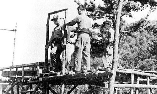 The ground school phase of airborne training was given to Special Mission Group (SMG) personnel at Yong-do in the spring of 1951.
