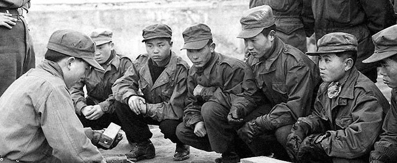 A guerrilla instructor teaches other members of his unit  basic demolition skills.