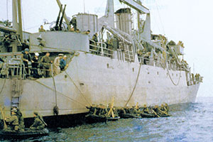 With LCVP tow training completed the RB-10s come alongside the Wantuck for boat recovery. The SMG soldiers climb rope ladders to come aboard.