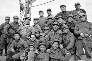 A group of SMG raiders wanted their picture taken with SFC James C. ‘Joe’ Pagnella while aboard the Wantuck.