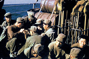 The SMG raiders enjoy the sunshine on the aft deck of the Wantuck amongst their RB-10s.