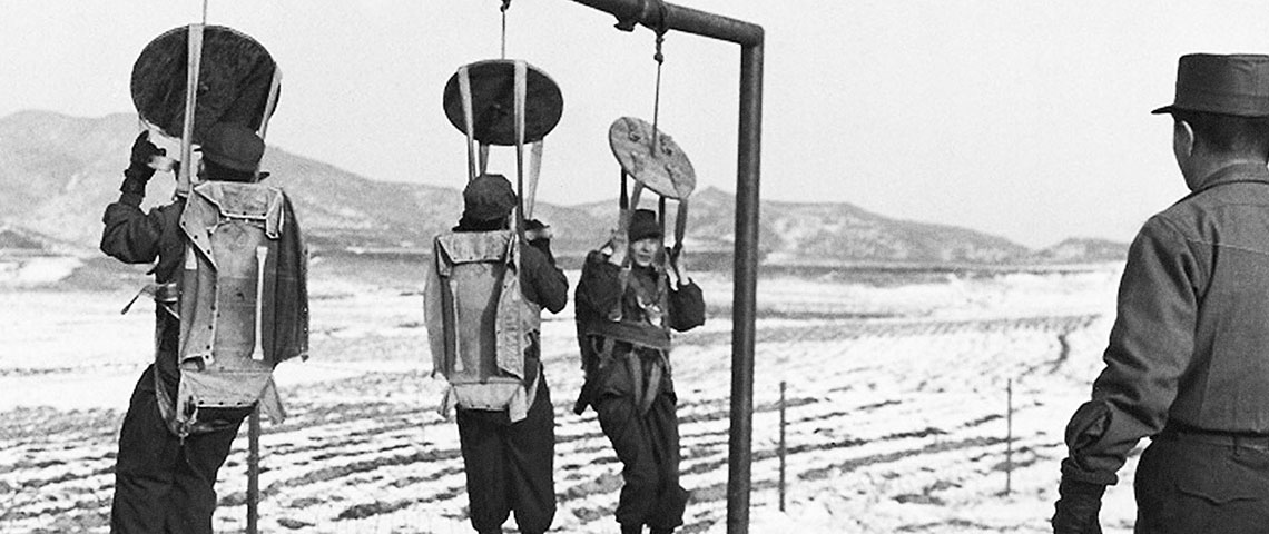 North Korean guerrillas conducting suspended harness parachute training.