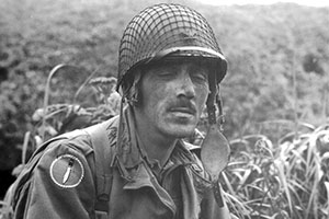 Colonel Frederick rests during operations on Kiska, 15 August 1943. The “Long Knives” patch of Amphibian Training Force 9 is on his right shoulder.