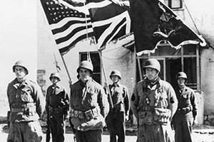 Presentation of Silver Stars to three men of the FSSF in March 1944 at their headquarters in Nettuno, Italy.