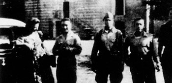 Near Ales, France, 1944. (L-R) Michael's wife; Henri,the French officer on Bank's Jedburgh team; Capt. Aaron Bank; Jean, the French radio operator on the team; Michel, a guerrilla and driver who could find gasoline anywhere. Car is a Citroen that had been commandeered from a collaborator.