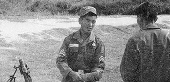 Sergeant First Class Tabata, 7th SFG, at a 60mm mortar range in the Plateau de Bolivens, training Laotian forces during Operation WHITE STAR, 1961.