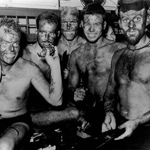 On board USS Burrfish before Gagil Tomil Island Mission, 18 August 1944. Recon Team during pre-mission dinner.